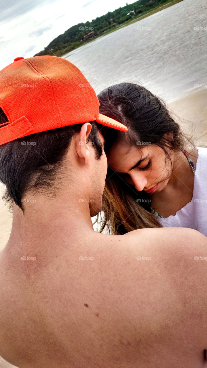 Close-up of a couple at beach