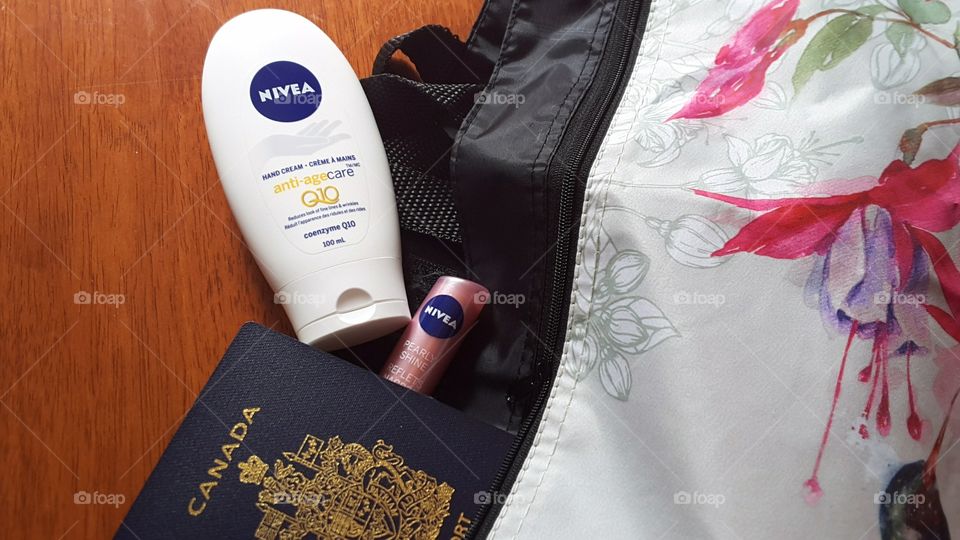 Travel bag with passport and Nivea products