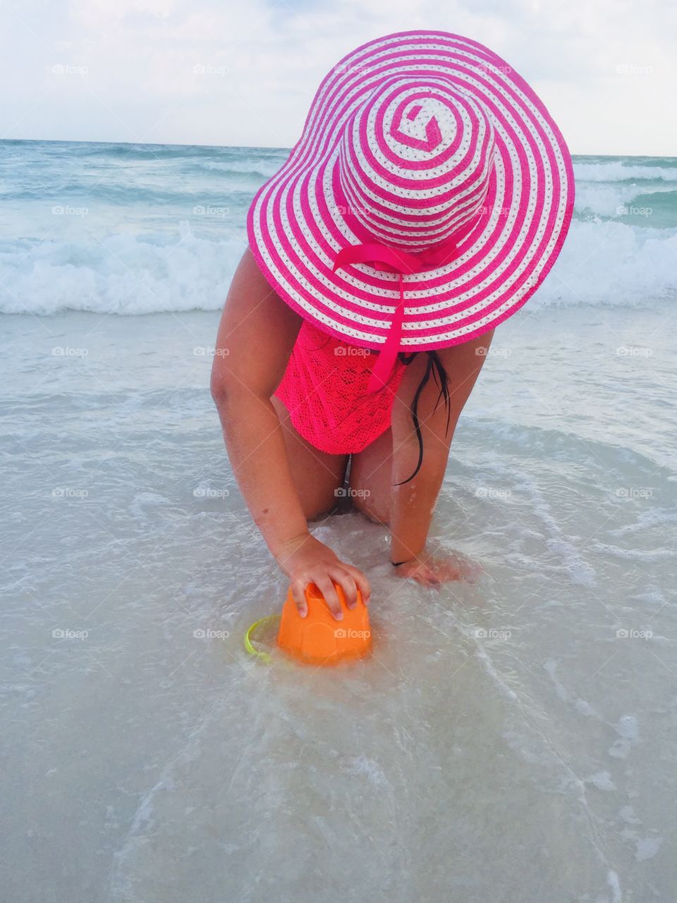 Pretty in pink while playing in the sand