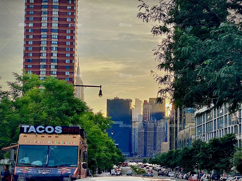The taco stand on “Vernon Jackson Ave” and a backdrop of “Borden Ave” running parallel to “Newtown Creek” an ocean inlet of the “East River”. 2022. Hypnotic Productions