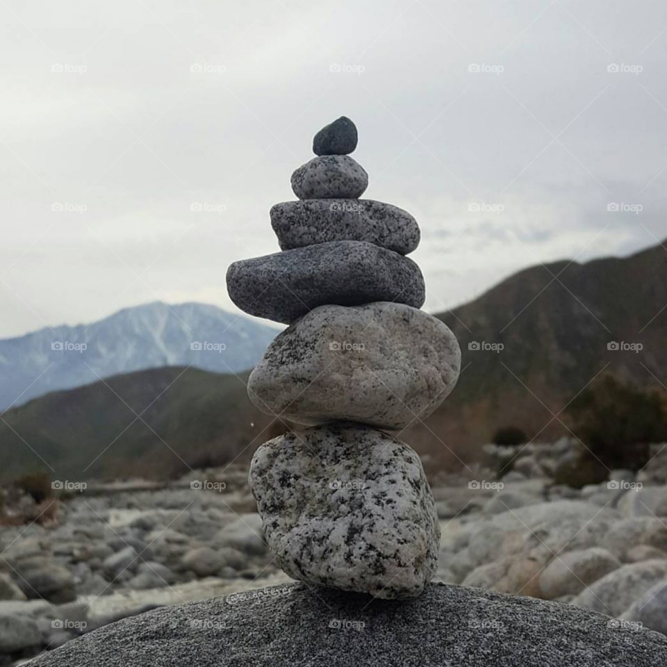 balance, rocks stacked upon each other at the ocean