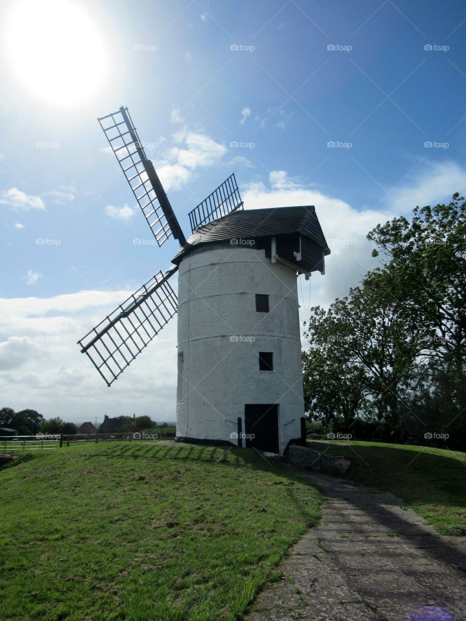 Ashton windmill with the sun shining down on a lovely summers day