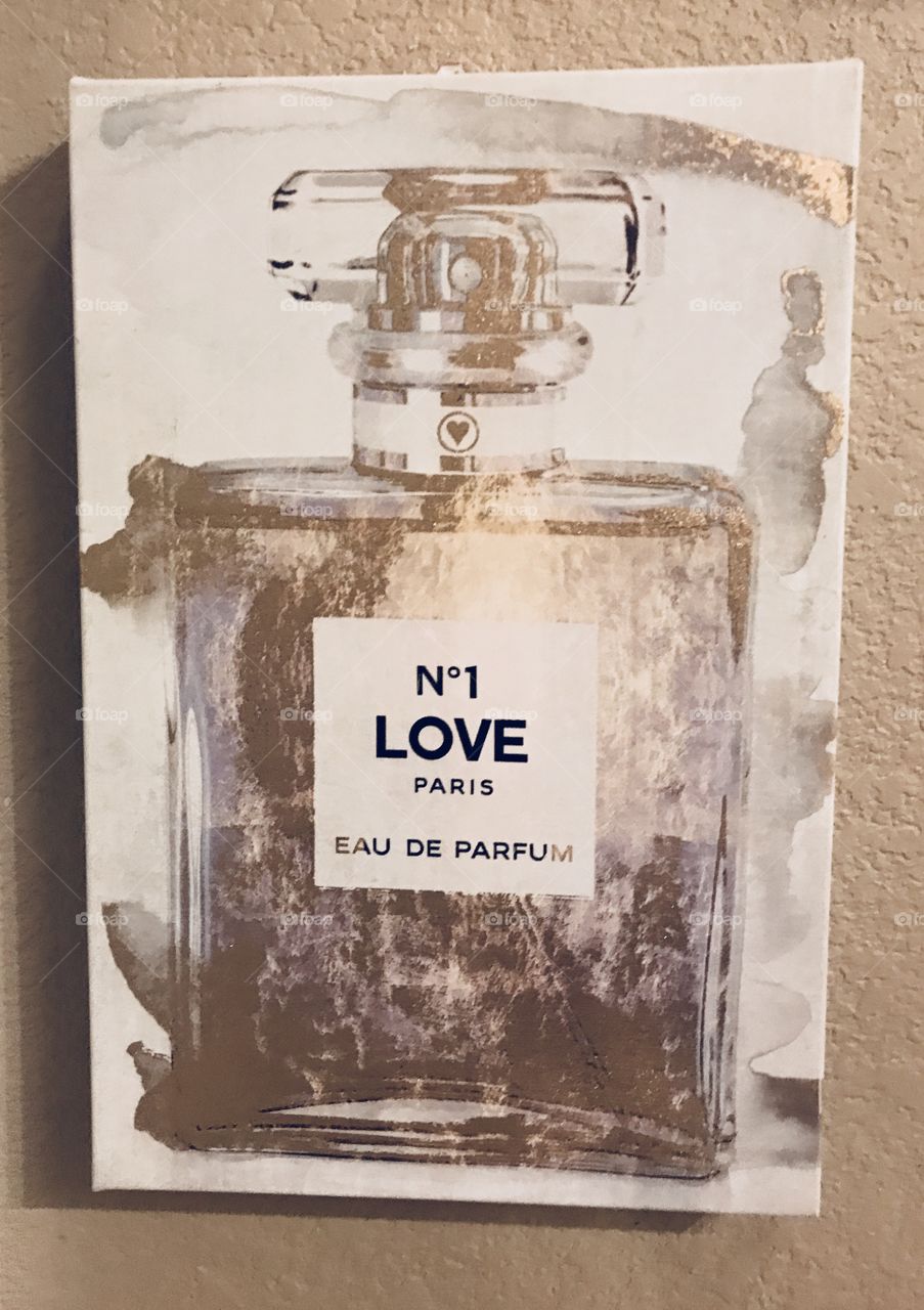 A beautiful Picture of No 1 Love Paris EAU DE PERFUME on display hung on the wall, Paris Hilton perfume. 