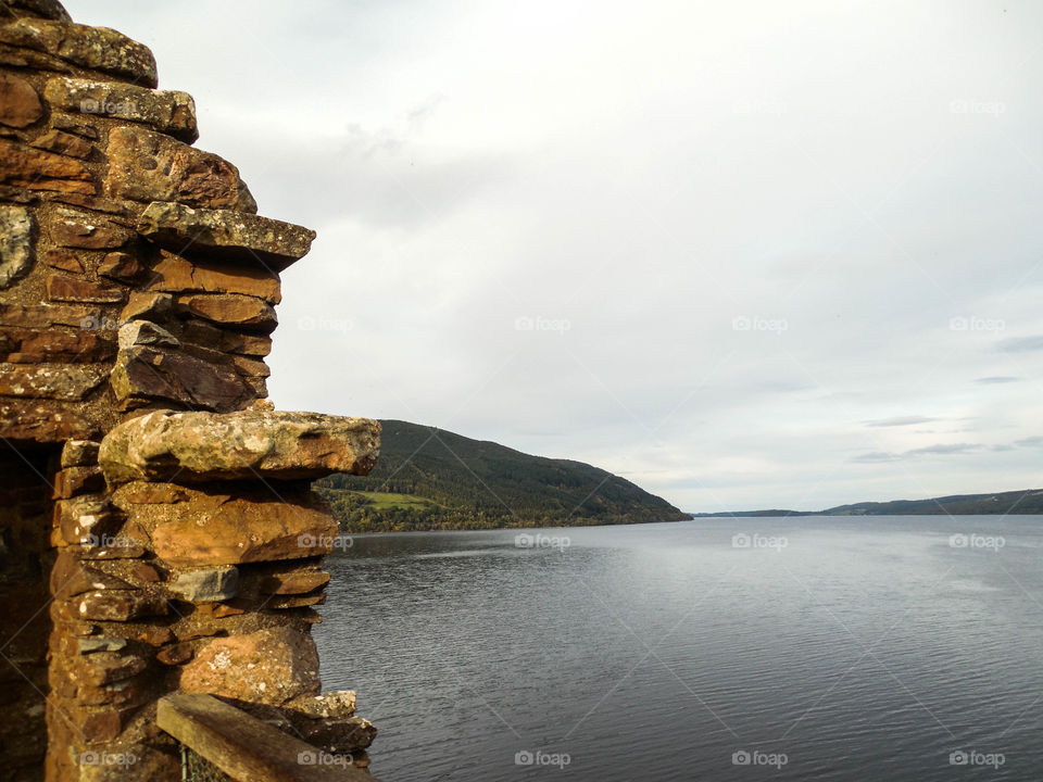 Crumbling Castle. The ruins of Urquhart Castle overlooking Loch Ness in Inverness, Scotland.
