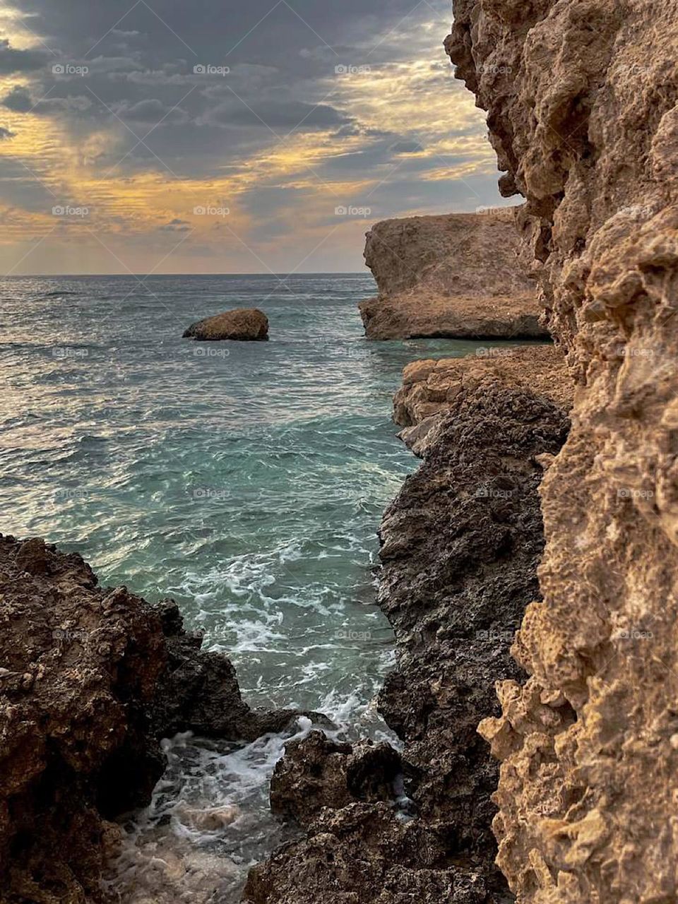 The meeting of the rocks with the sea and the meeting of the sky with the clouds