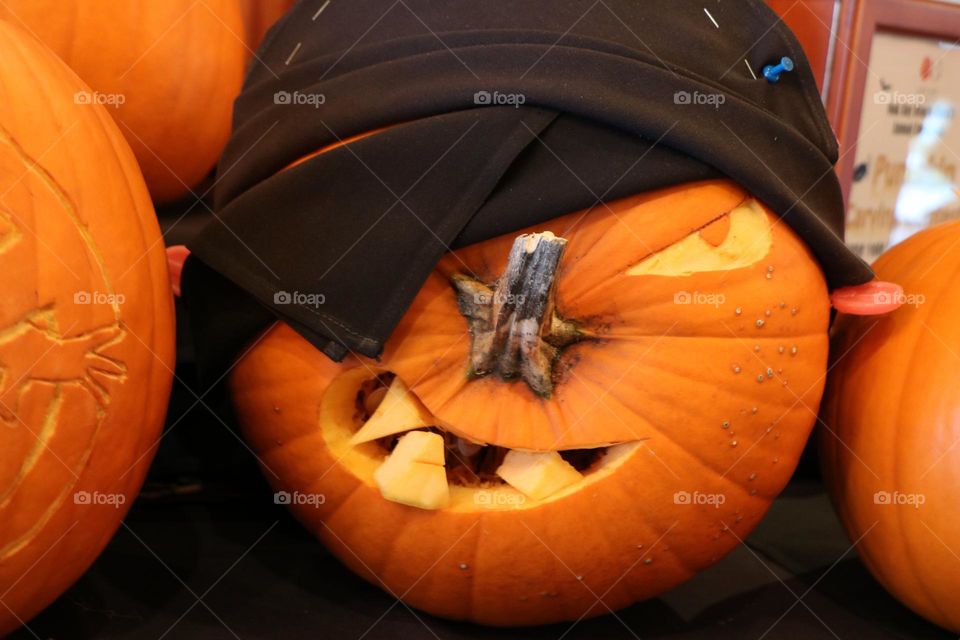 Carved pumpkin with a patch