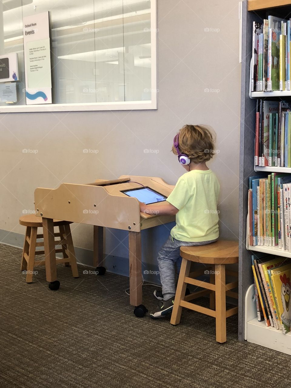 Boy playing on iPad