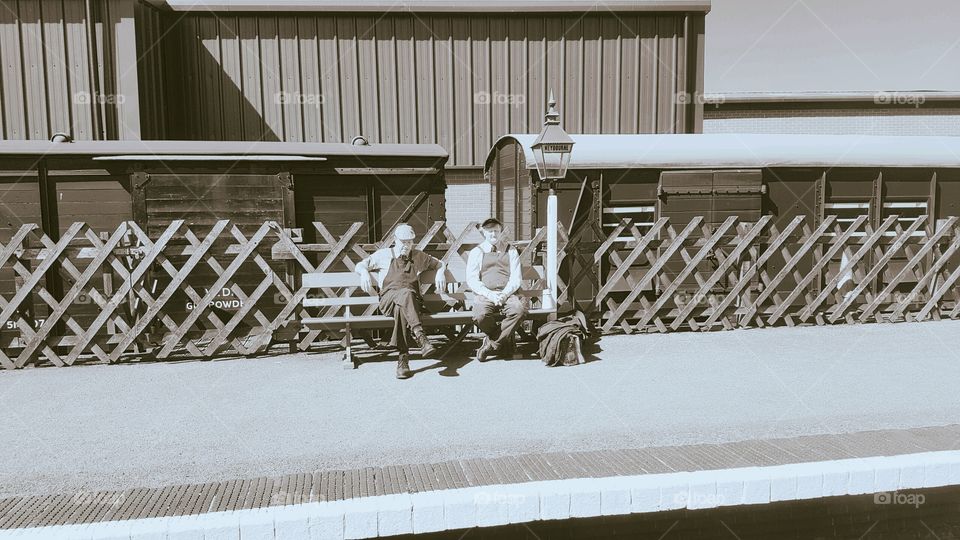 Weybourne train station with 2 workers