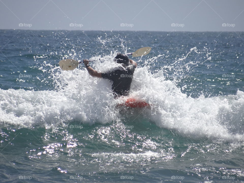 Kayaking through the surf
