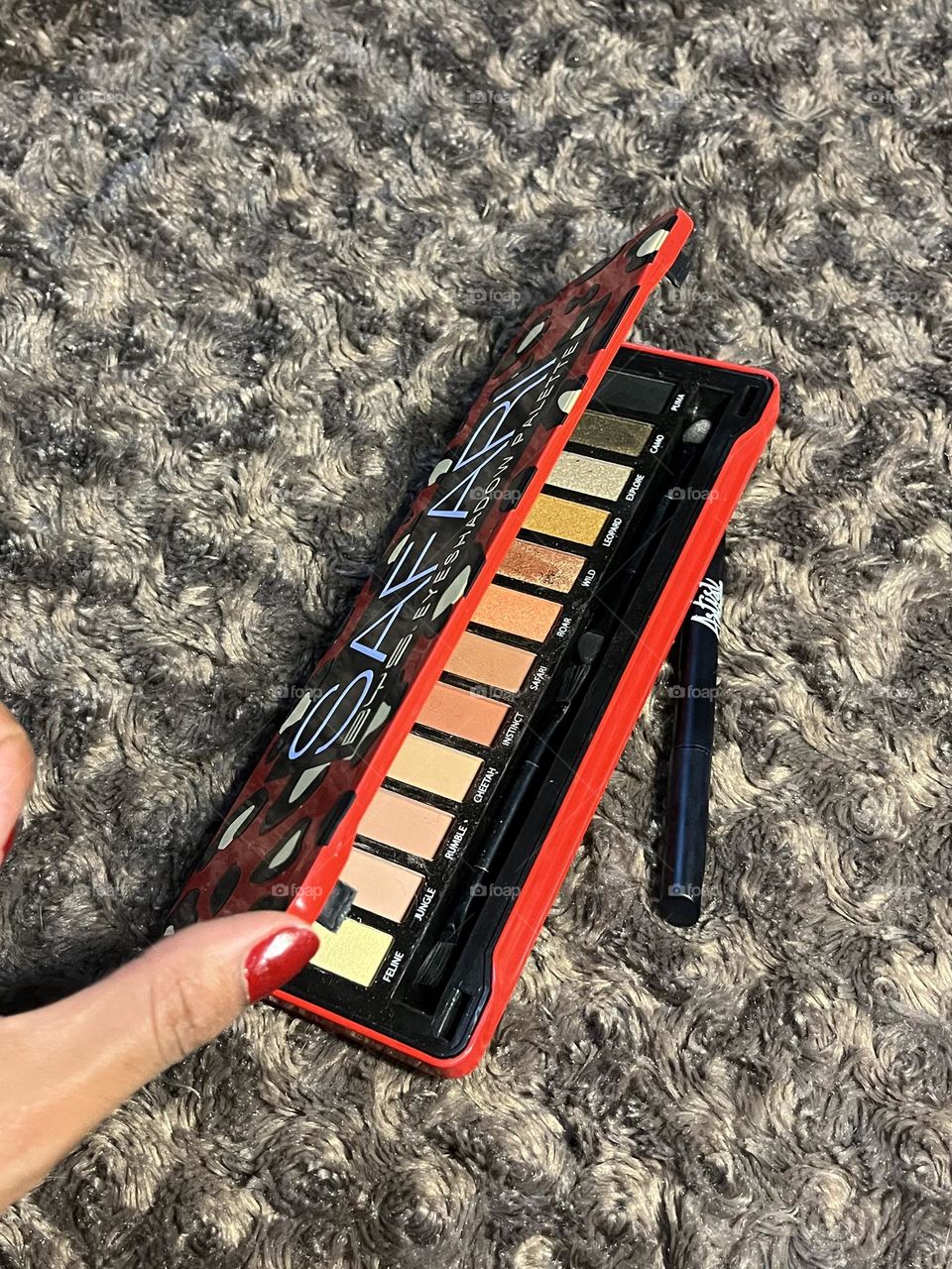 Eyeshadows eyeliner and my hand