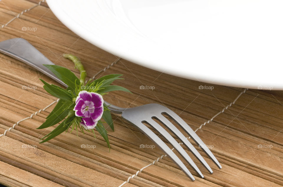 Flowers fork white plate