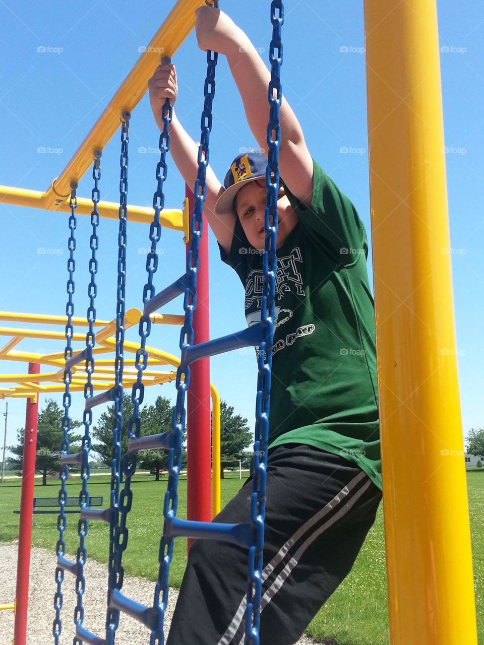 climbing on the playground equipment / faces of autism