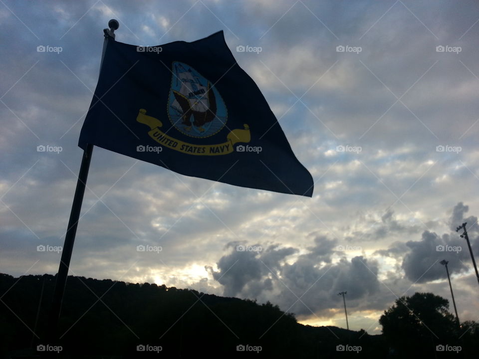 Navy flag in the sunset