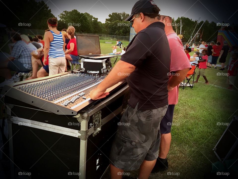 Summer concert directed by sound technicians.