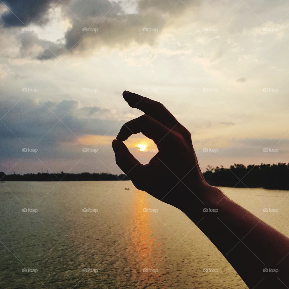 Hand sign language background sunset sky