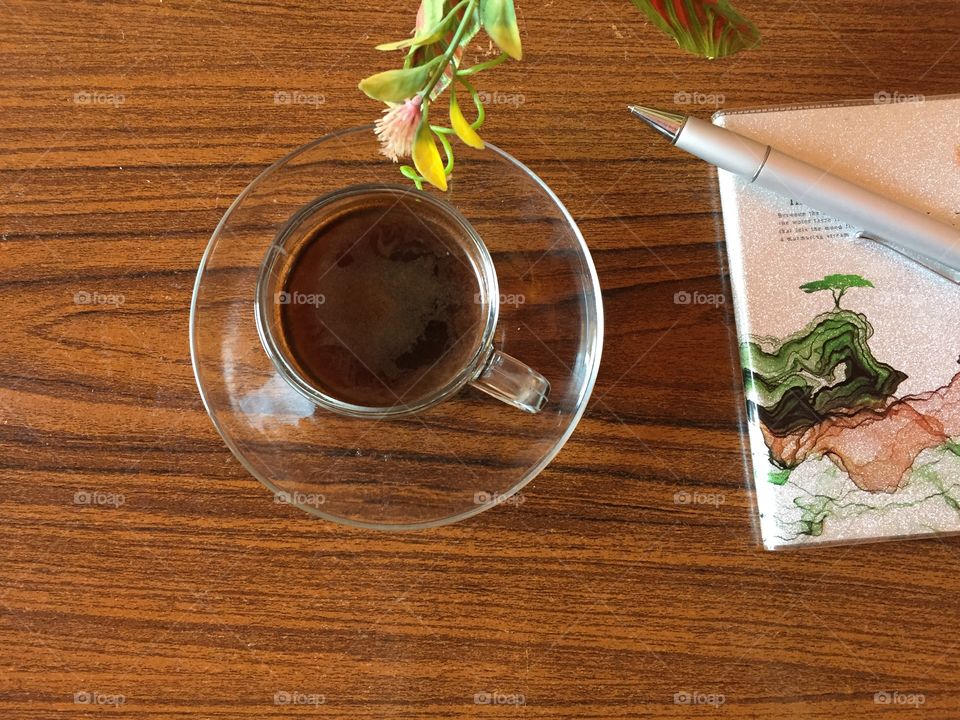 Cup of coffee in wooden background 