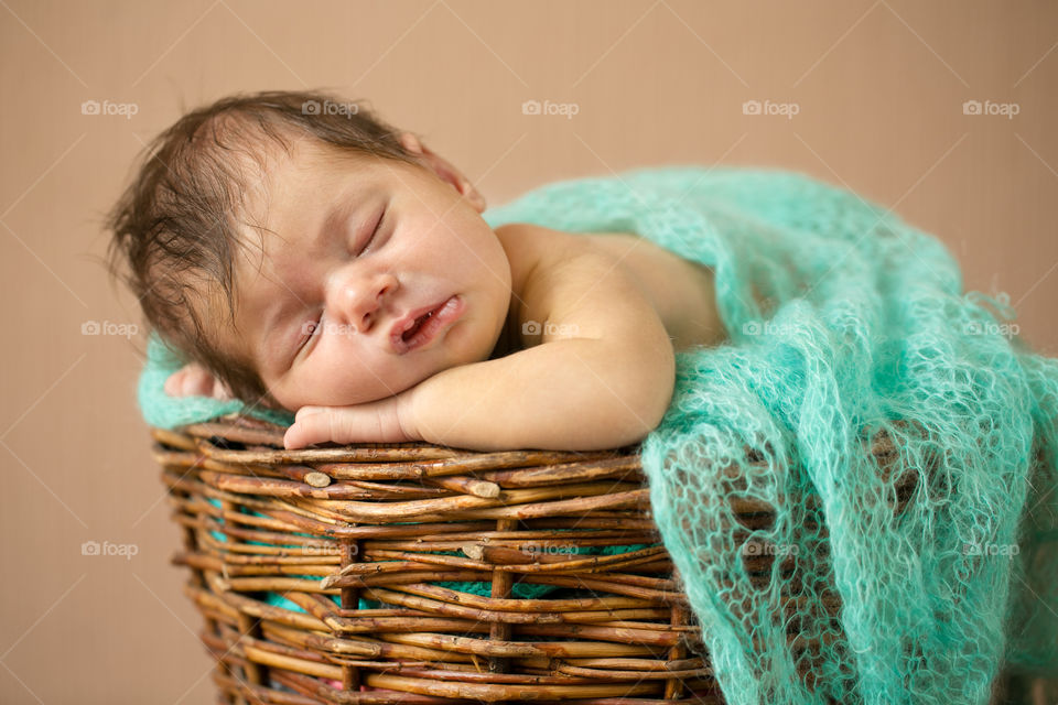 Baby sleeping in basket