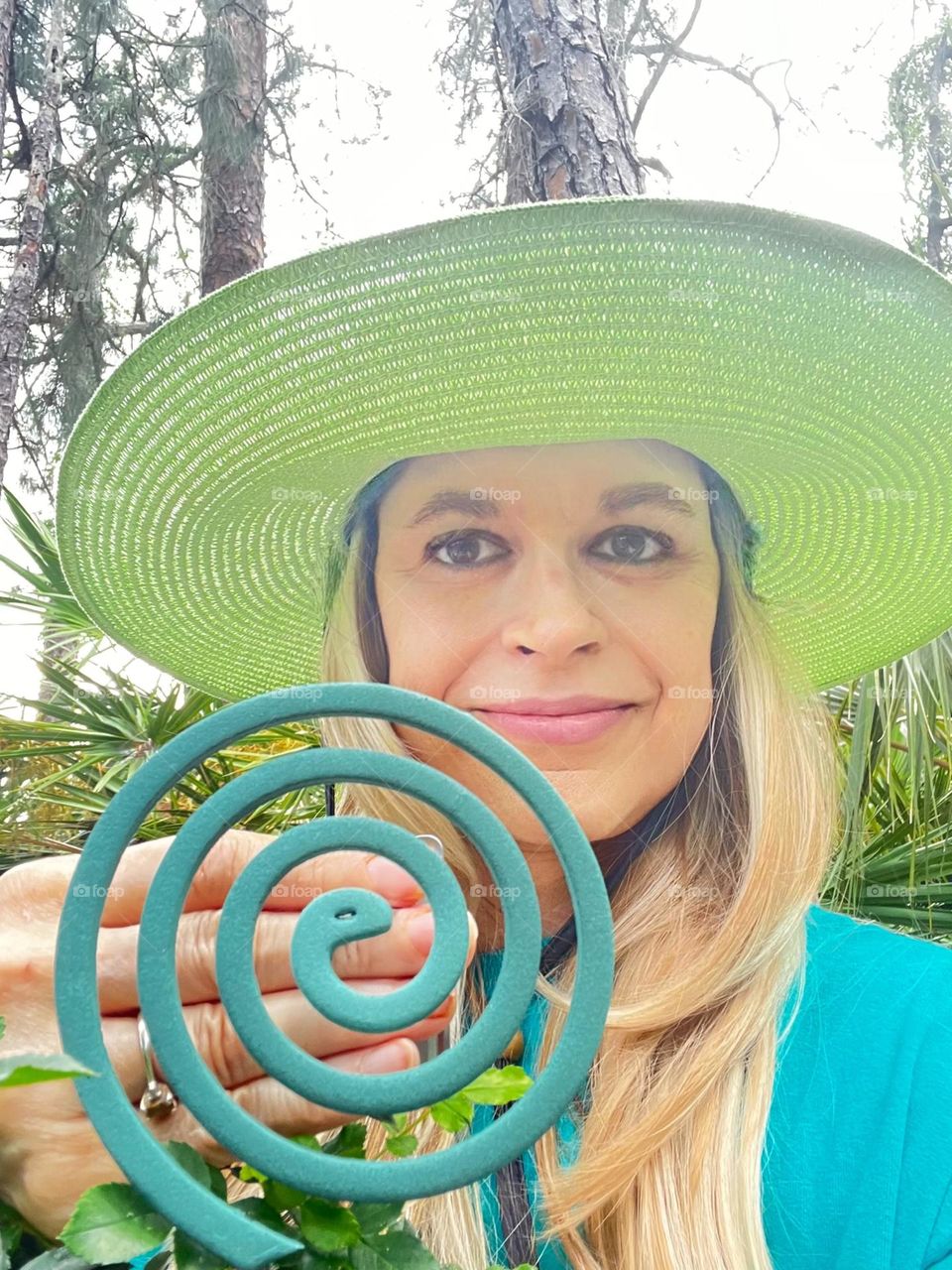 Model displaying a very effective mosquito coil for pest free picnics. 