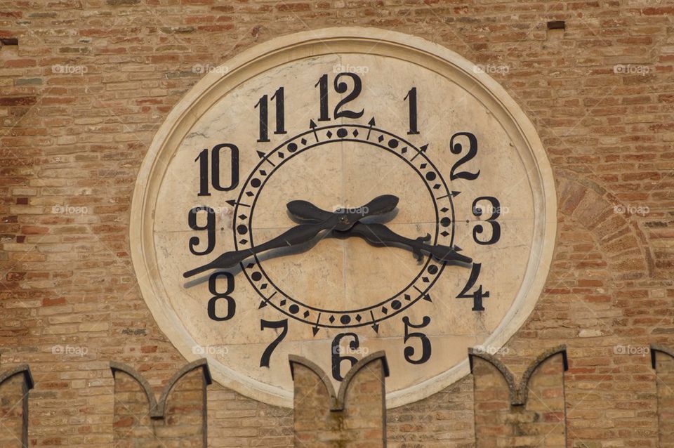 Town Hall belfry closeup clock, Offida,Marche,Italy