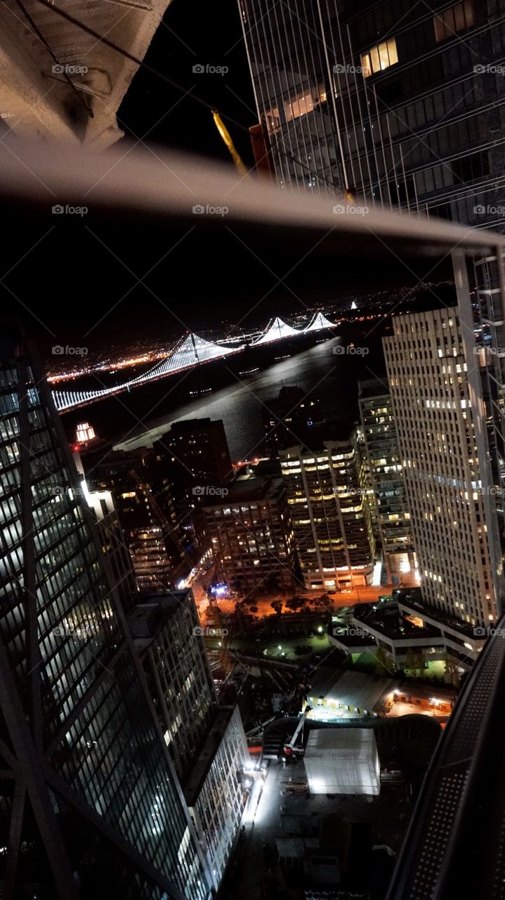Bay Bridge Beauty - Reflections on New Years Eve... when everyone was out partying we were climbing Sales Force before it became a force. This is the view hanging off the side of the building. (Safely of course)