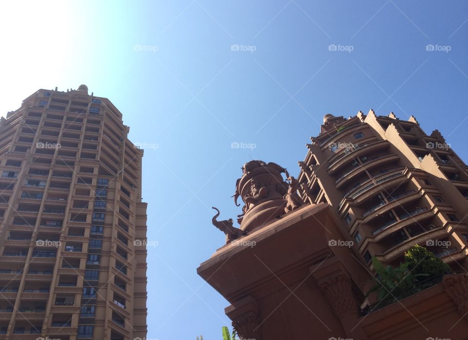 China, Yunnan, Xishuangbanna architecture. Blue sky. No person. Elephant 