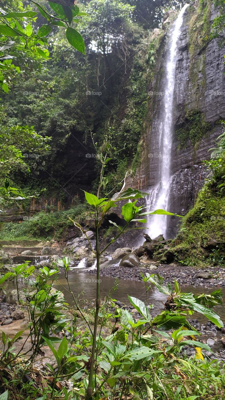 Waterfall tourist spot Batu Mahpar, in Tasikmalaya, West Java, Indonesia.  Taken on December 5, 2021.