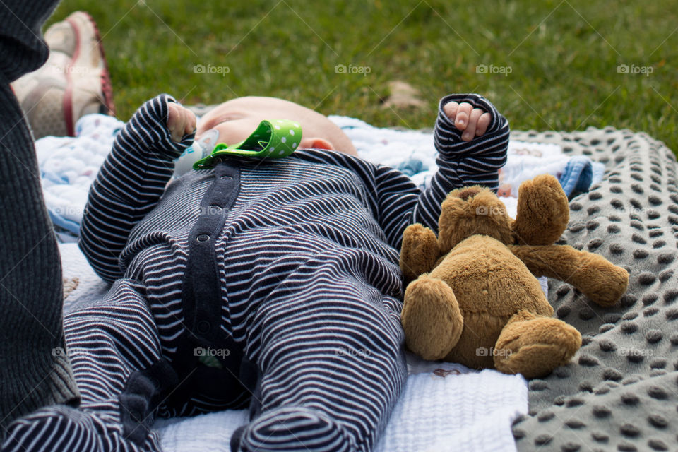 Baby and his puppy at the lake 