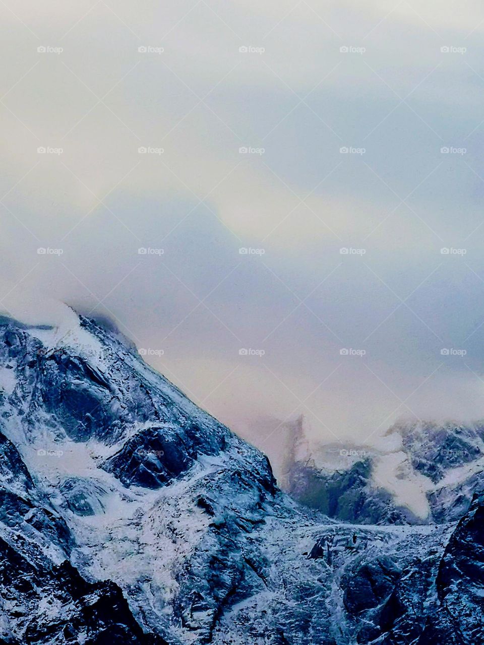 Snowing on peaks of himalayas