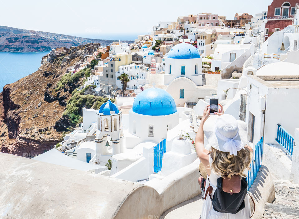 Woman Taking Photo With Smartphone In Famous Greek Island Santorini