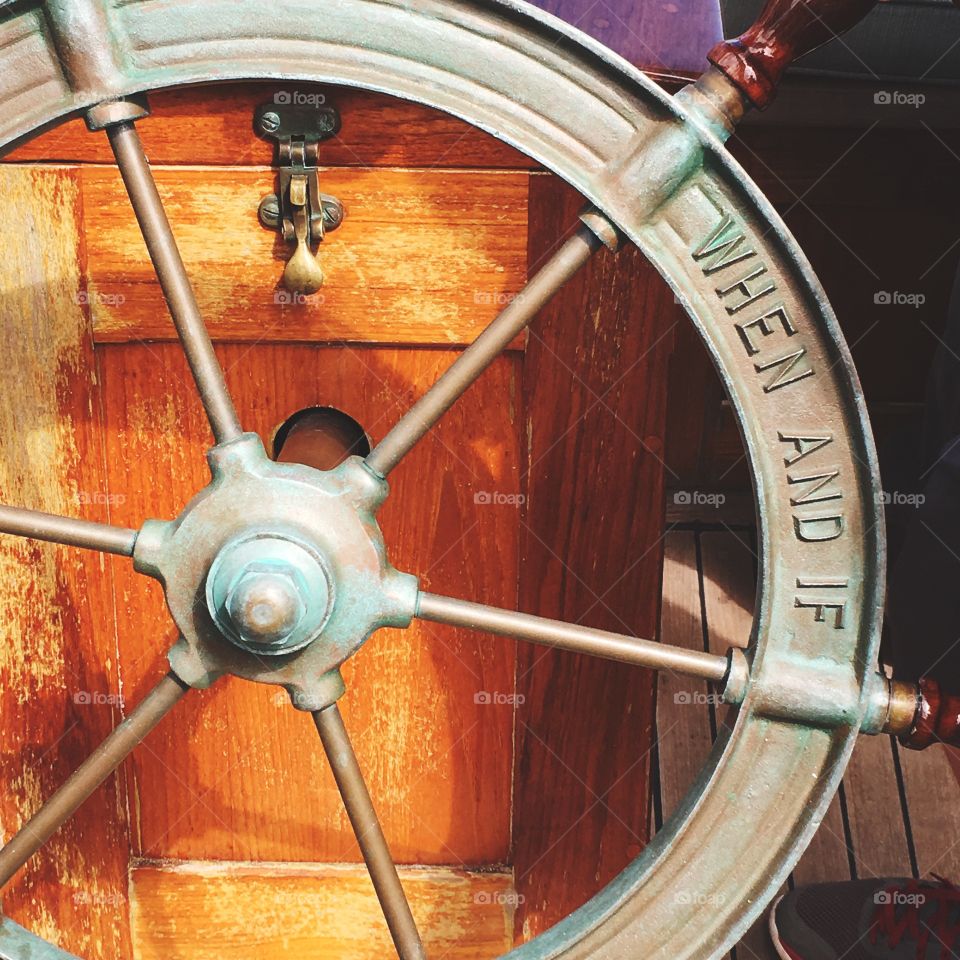 The helm of the vintage sailboat the When and If 
