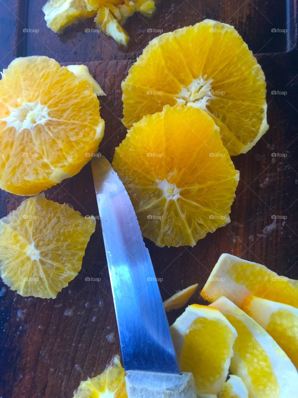 Preparing oranges for fruit salad
