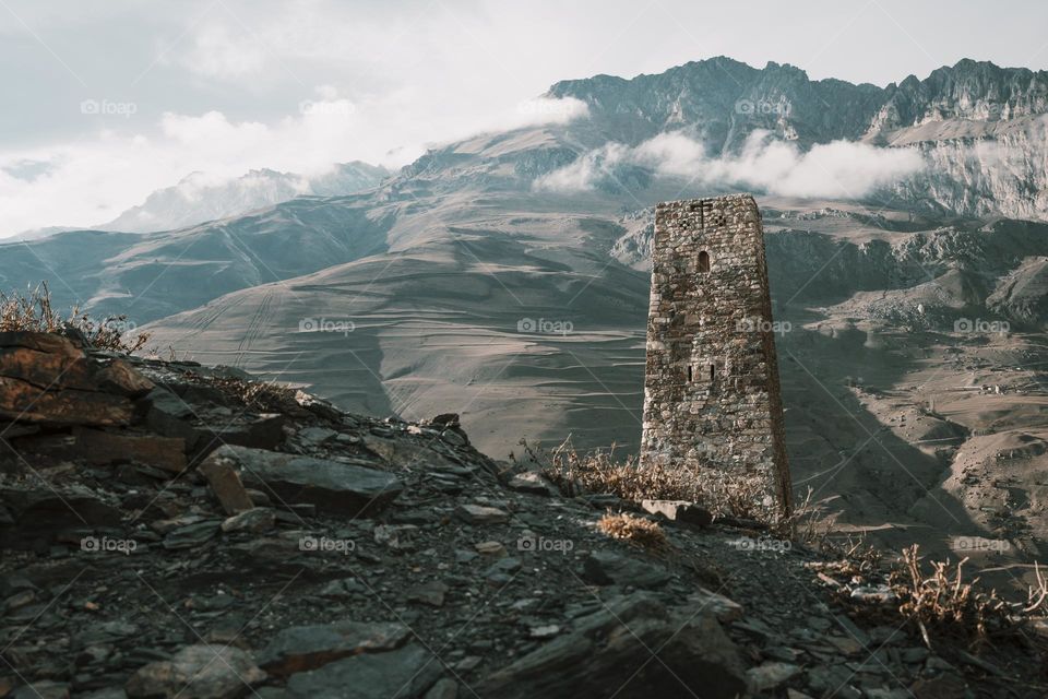 ancient stone tower in Caucasian mountains