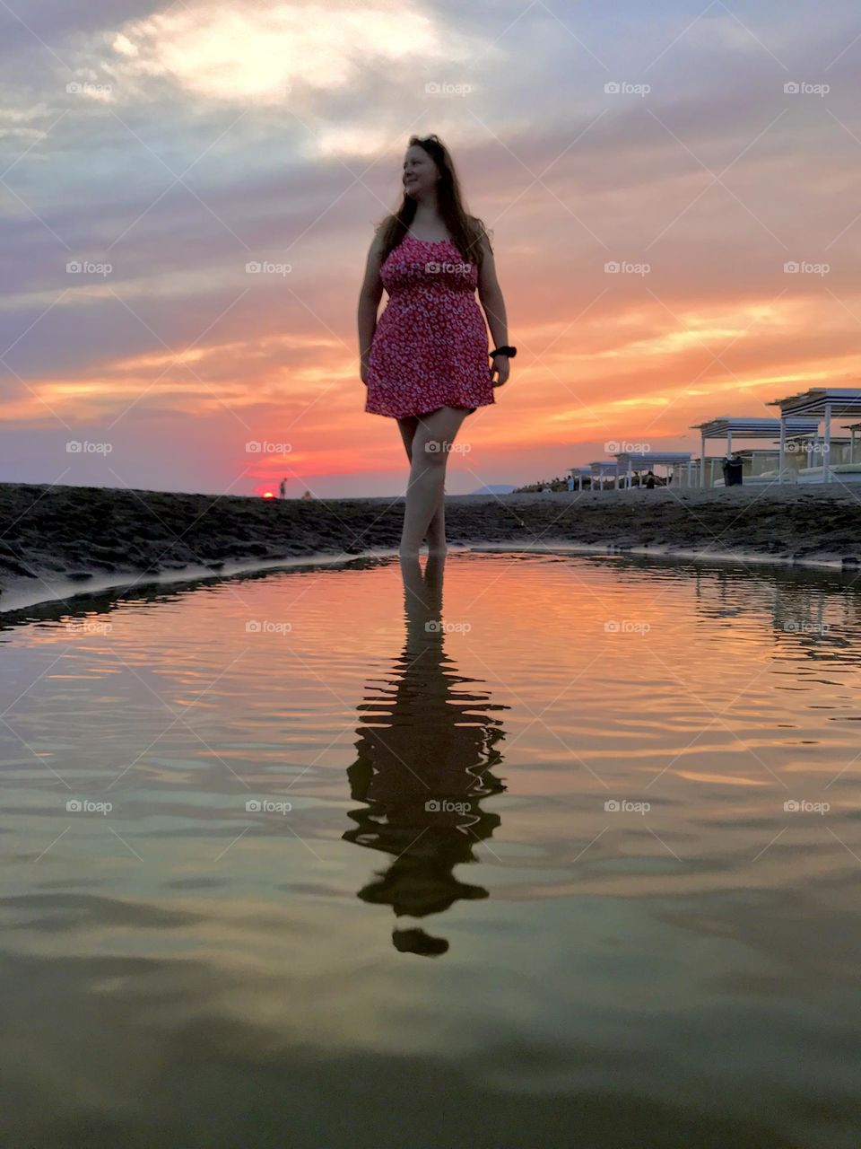 Reflection of a young girl during the sunset