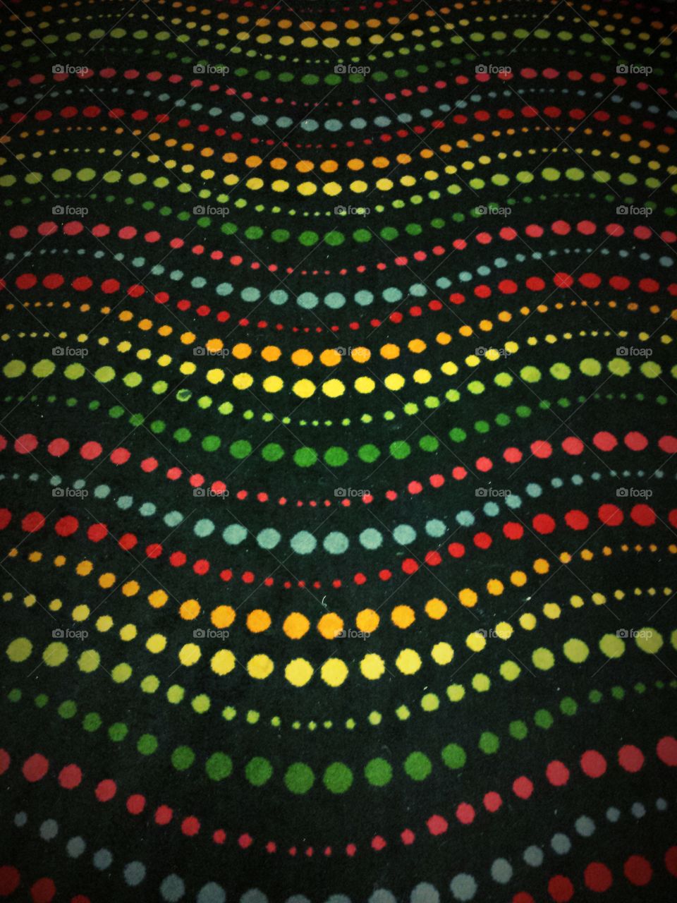 Pattern with colorful polka dots on black background