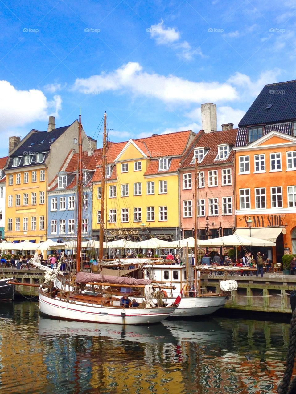 Nyhavn in Copenhagen. Boats and coloured houses in Nyhavn, Kopenhagen