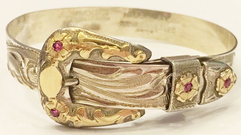 Hand engraved silver and gold bracelet with rubies. 