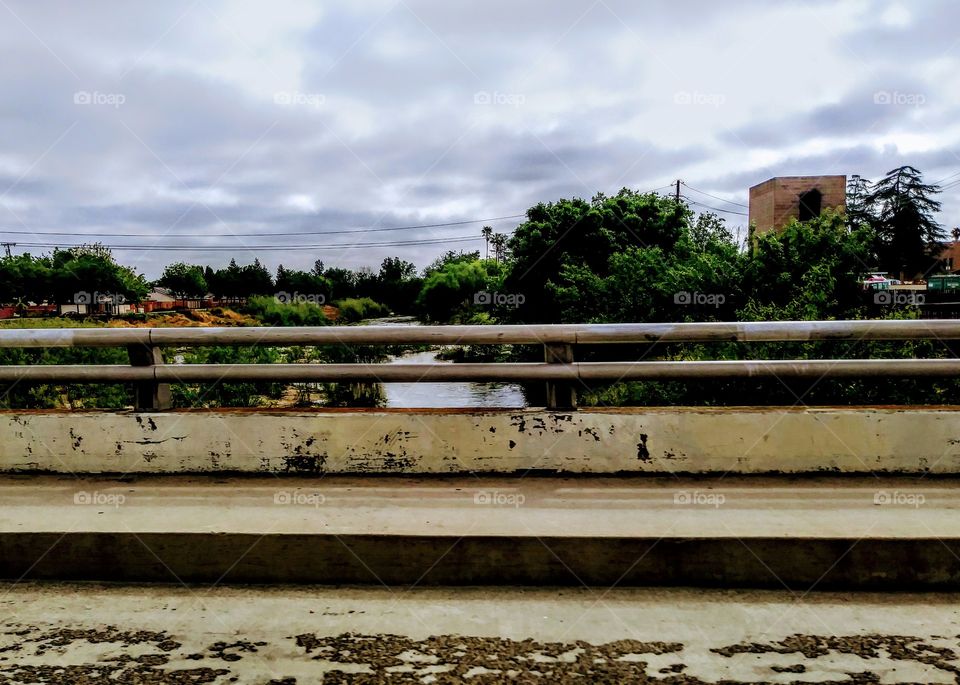 side of road. cement railing of bridge