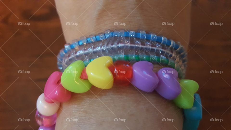two handmade bracelets made by children