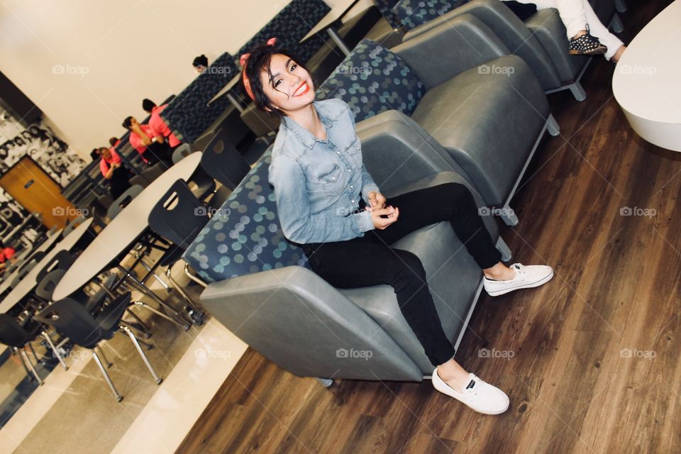 Smiling girl sitting on chair