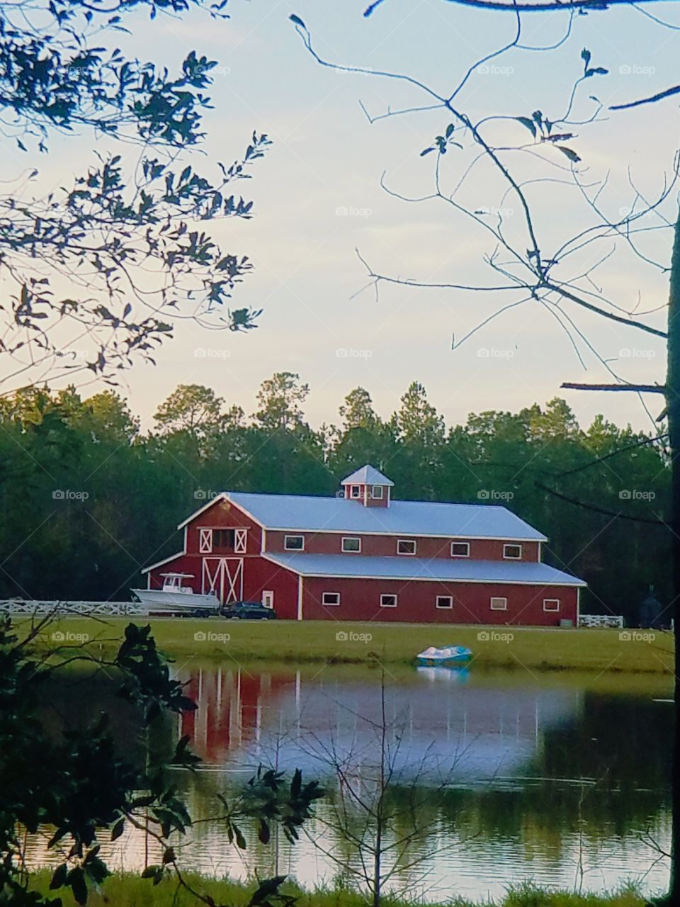 beautiful reflections of an old red barn