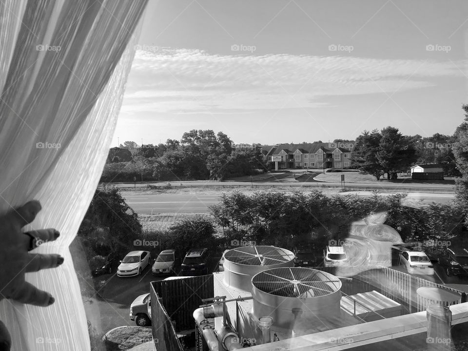 Looking out a hotel window to see the world 