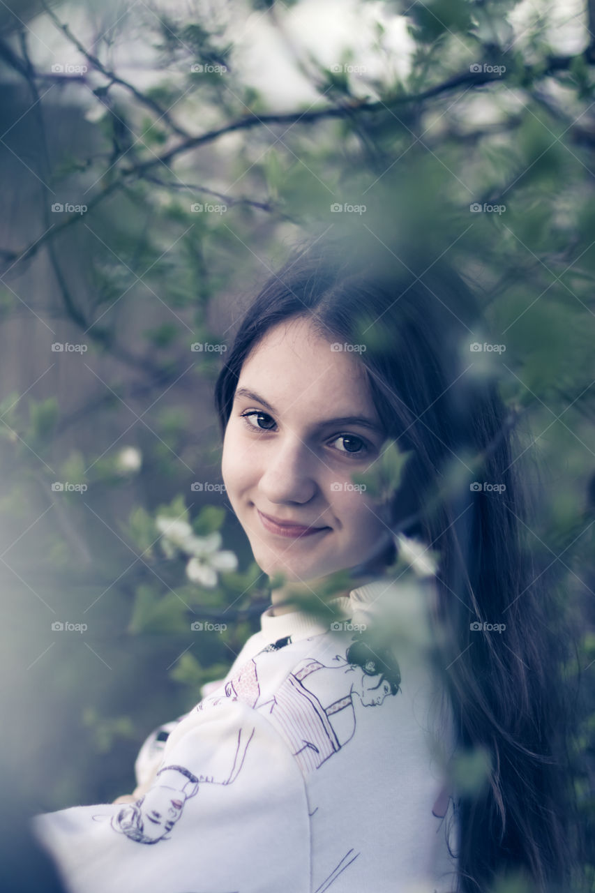 Portrait of teenage girl in the garden.