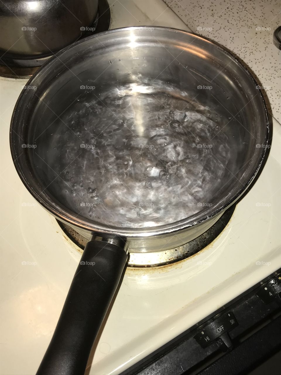 To the boiling point. The water from the faucet is appropriately distilled in the pan to make it drinkable.