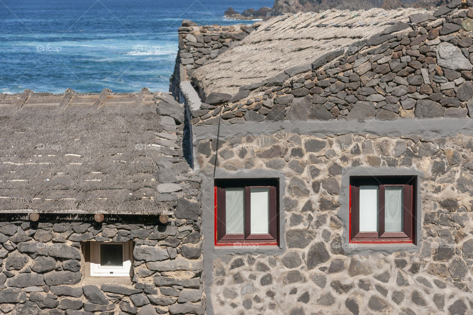 Squares.  Windows on a stone house in the Canary Islands