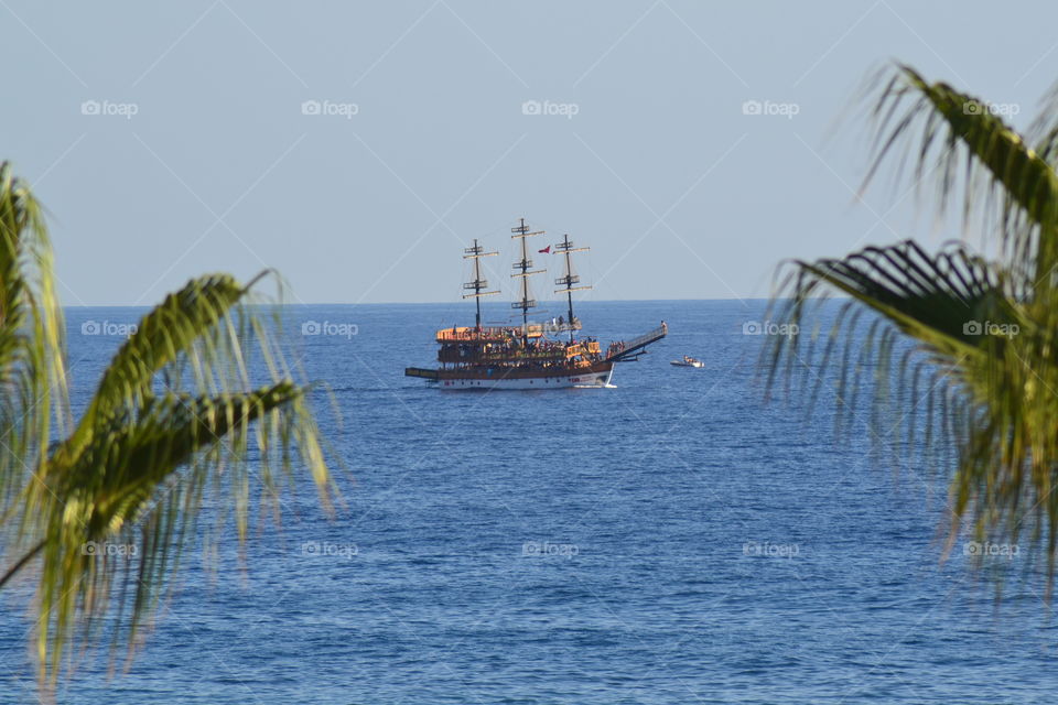 Boat sailing in blue sea