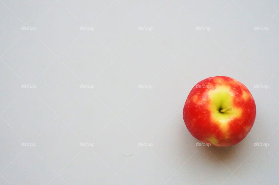 Red apple isolated on gray background 