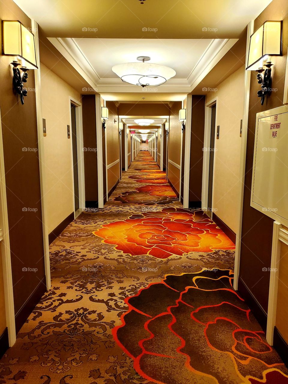 A long hotel corridor seems to stretch on practically forever