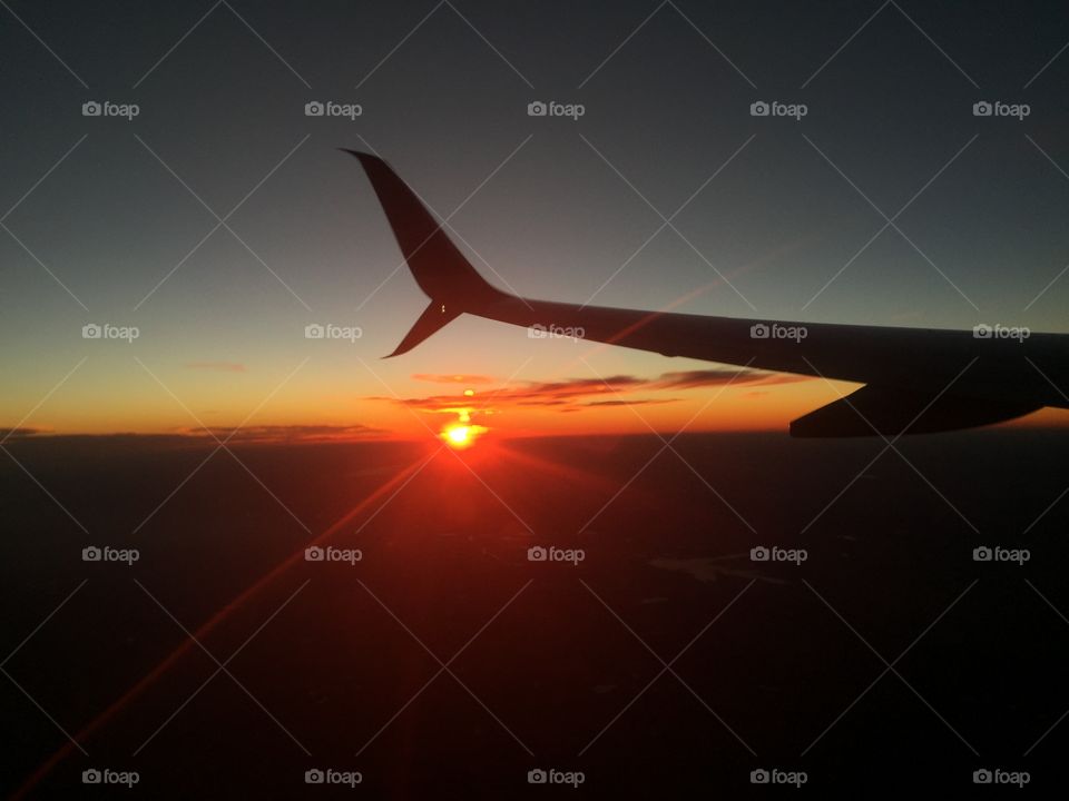 Airplane window shot sunset