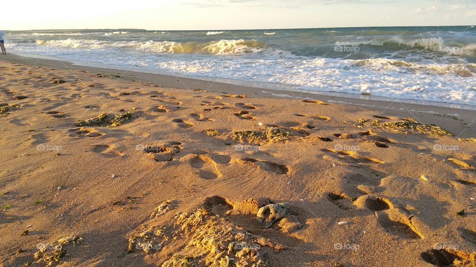 sunset footprints beach