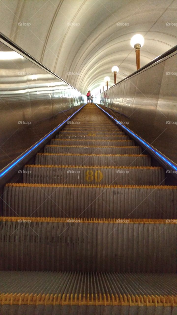 Long subway escalator